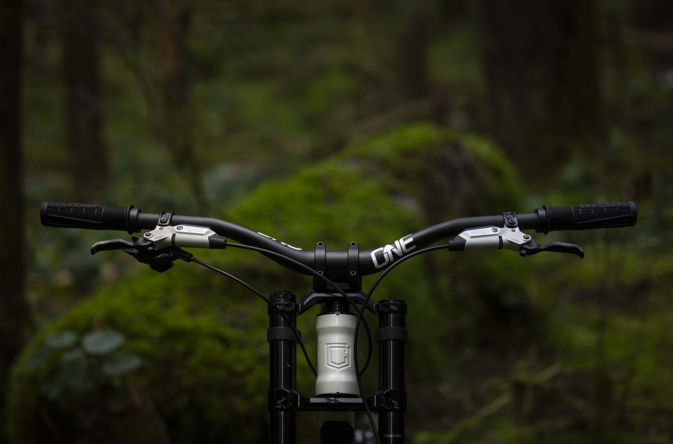 2025 oneUp Components V2 Carbon Handlebar riding hero.jpg OneUp offers improved compliance and more rise with its V2 carbon handlebars