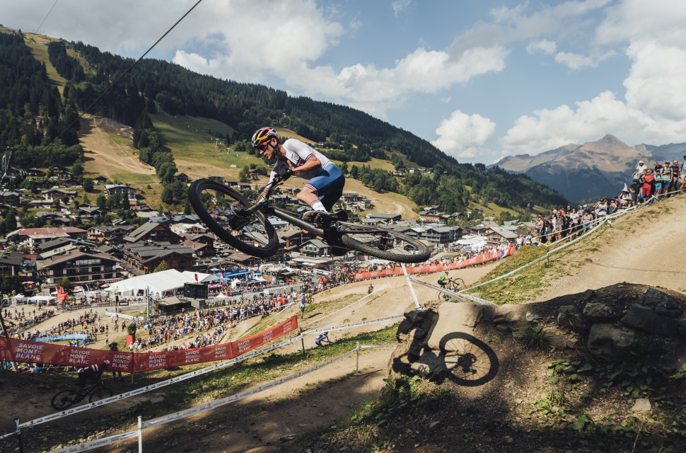 Tom Pidcock tail whips over gap jump at Les Gets, 2022 UCI MTB World Championships 2023 UCI Mountain Bike World Cup schedule – a huge year in MTB